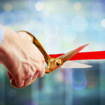 Ribbon-cutting ceremony symbolizing steps to obtain an alcohol license in Boston, Massachusetts.