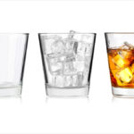 Booze, politics & law: Glasses symbolize debate on cutting the legislative cord for alcohol.